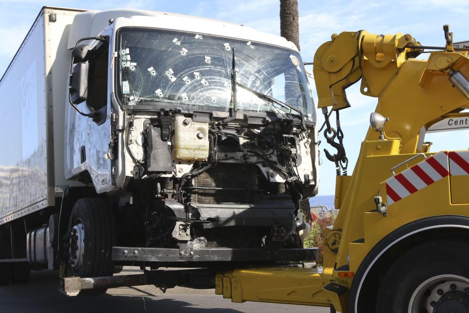  The truck involved in the fatal attack on the streets of Nice is towed from the scene