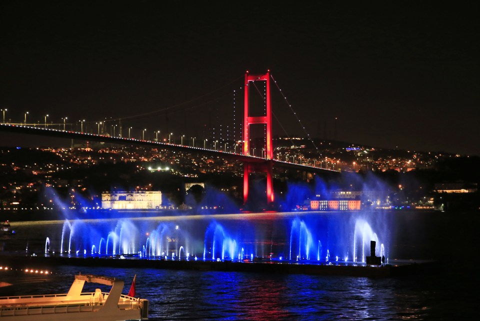 Istanbul's iconic Bosporus Bridge is lit in the colours of the French flag on Friday