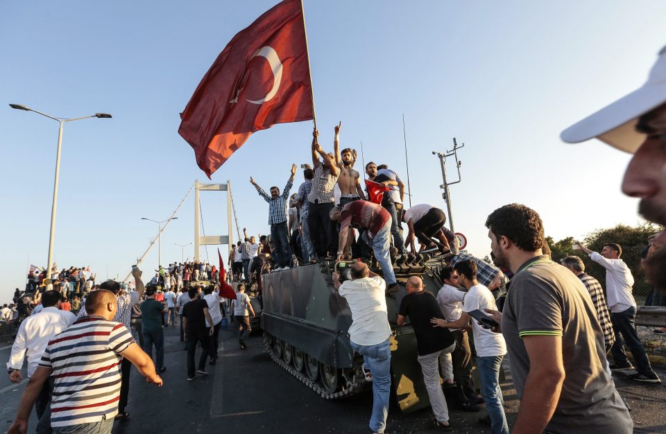  Civilians celebrated as soldiers on the Bosphorus Bridge in Istanbul surrendered