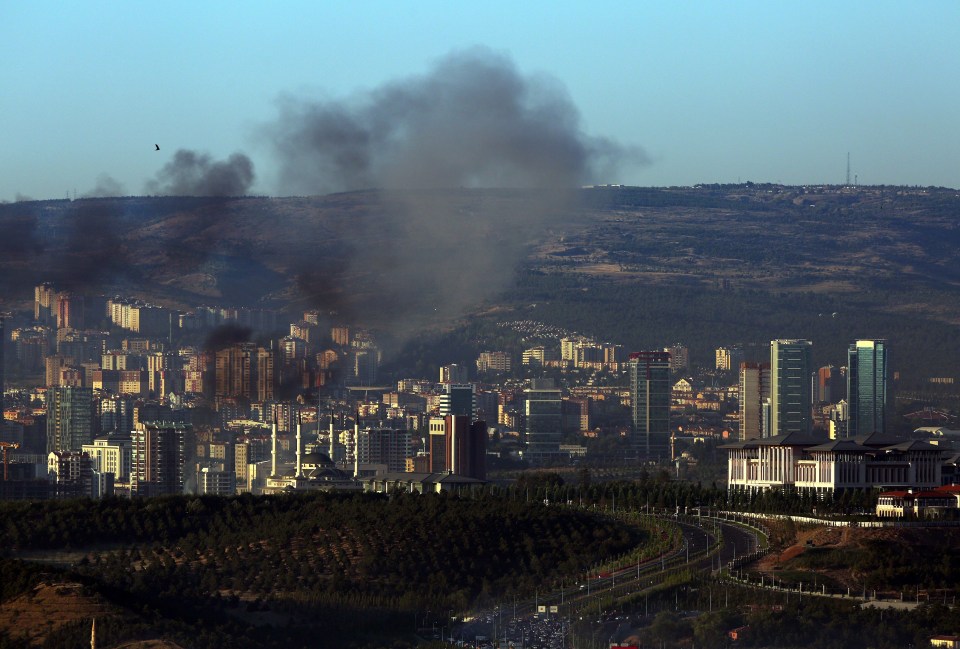  Smoke billows from an area near the presidential palace