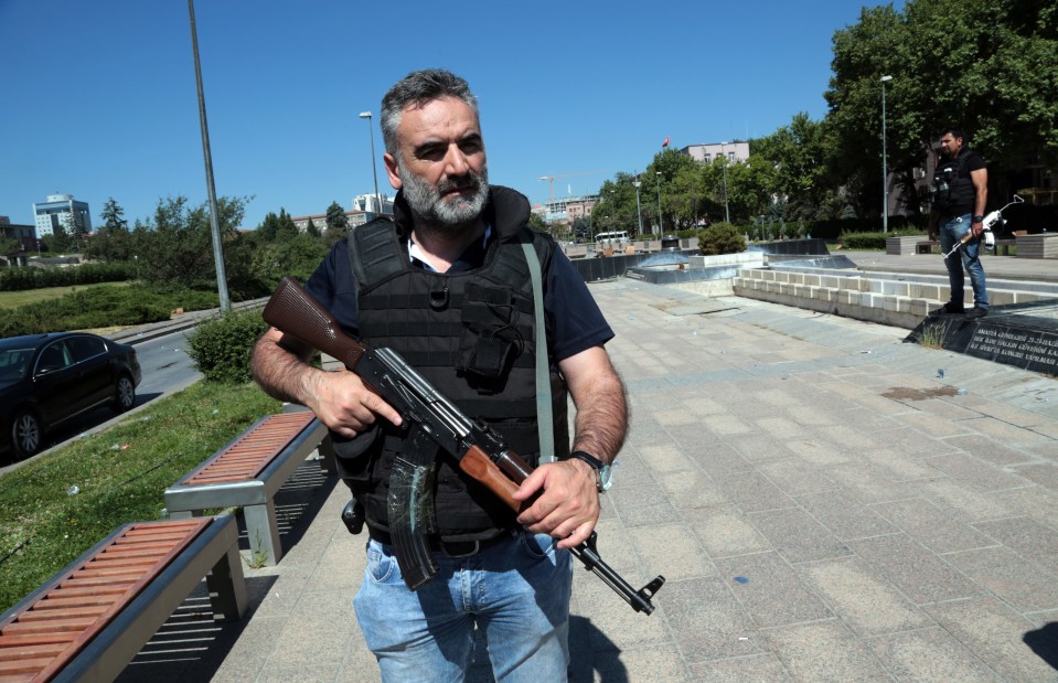  A police officer stands outside Turkey's parliament near the Turkish military headquarters in Ankara