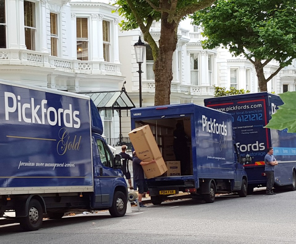  A convoy of removal vans pulled up outside the Beckham's London home