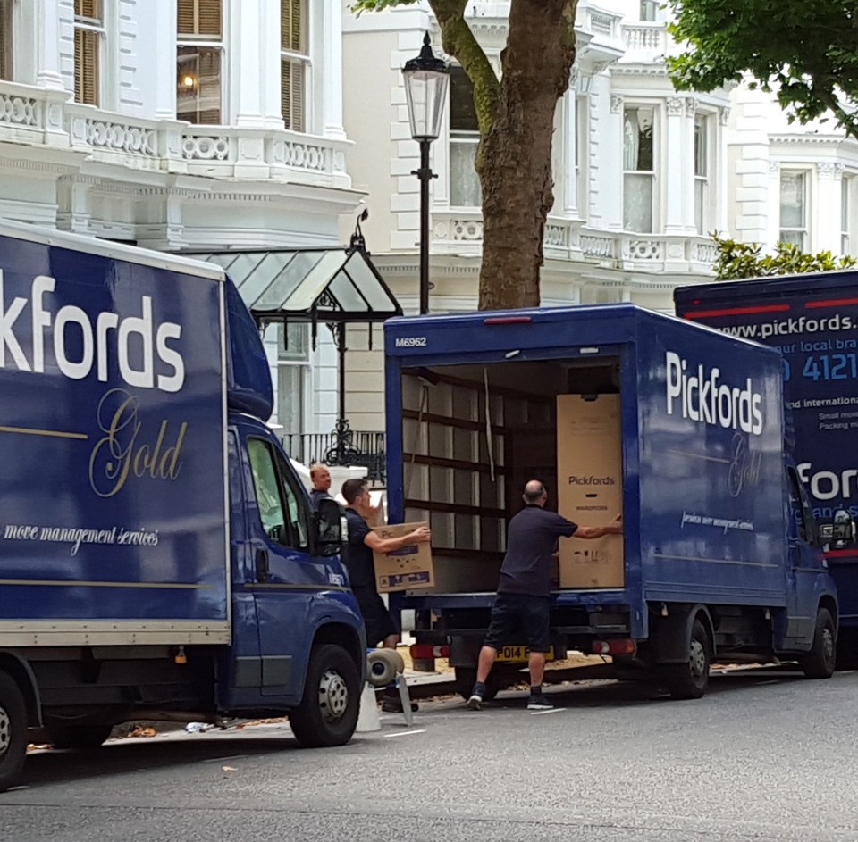  Workmen were seen filling the three trucks high with crates