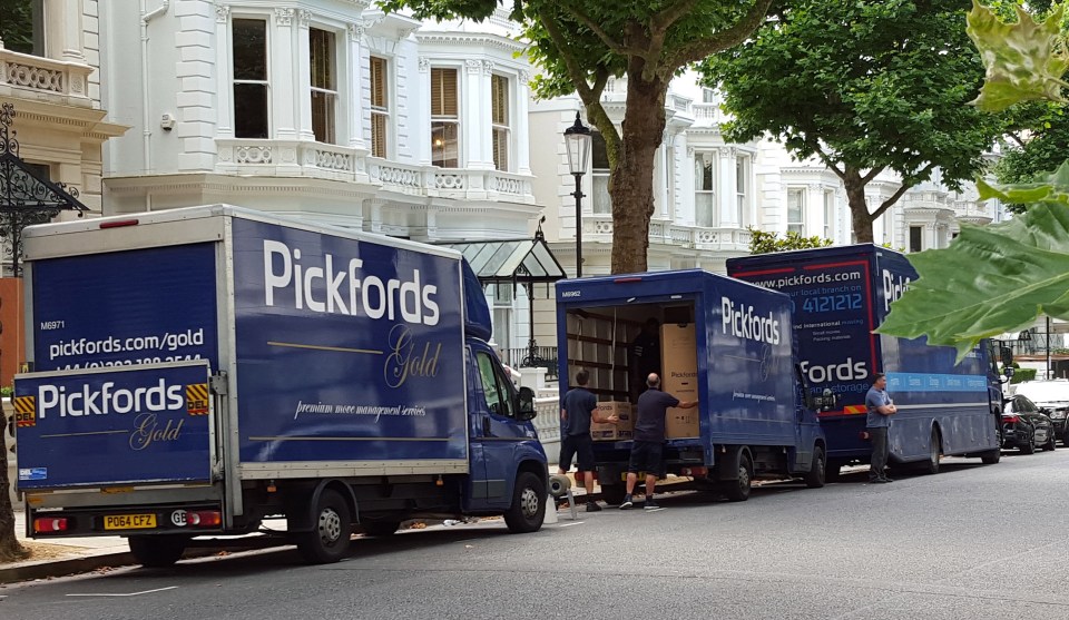  The vehicles parked on the swanky tree-lined street