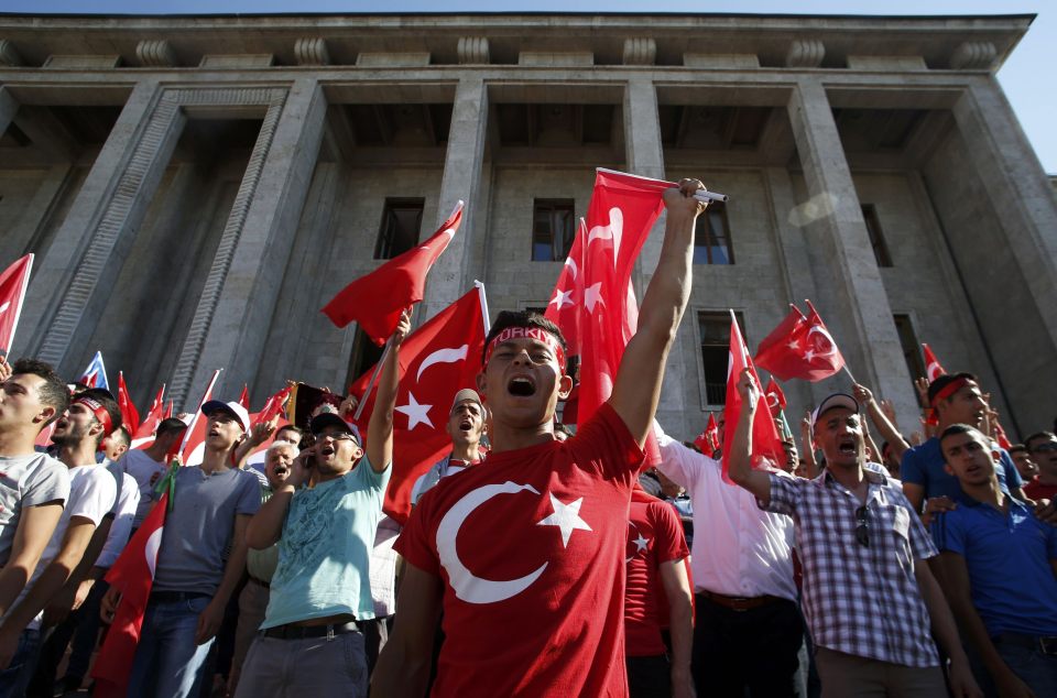  Erdogan's supporters today waved Turkish flags and cheered as the soldiers surrendered