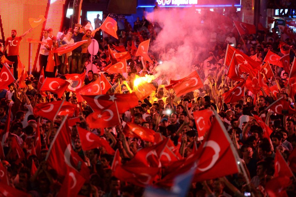  Thousands of people hold Turkish flags during a demonstration against the failed coup army attempt in Ankara