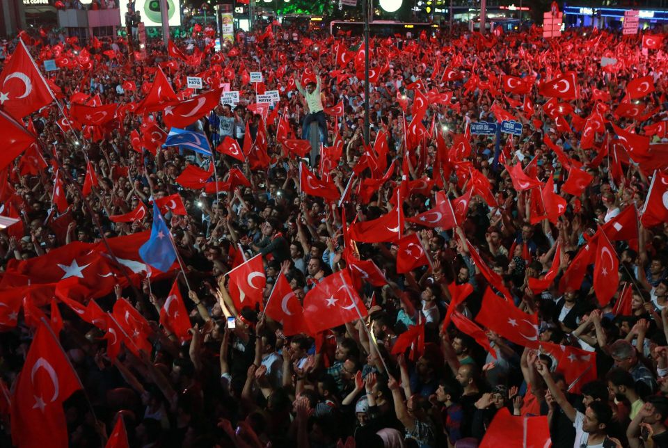  People wave flags as they gather in Kizilay Square in Ankara