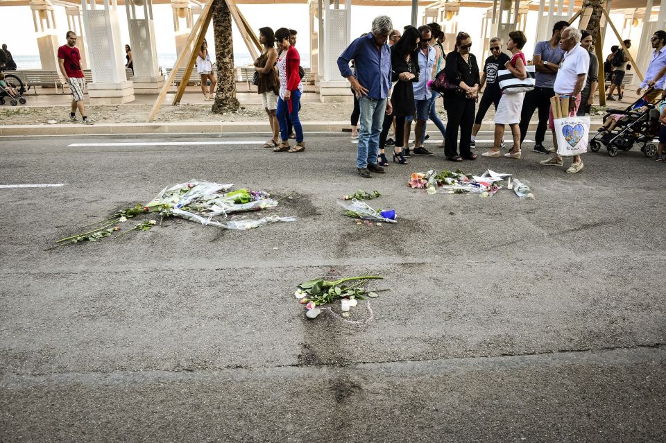  Heartbreaking scenes show flowers placed over bloodstains on the Nice promenade where a Tunisian national attacked a crowd of children and families