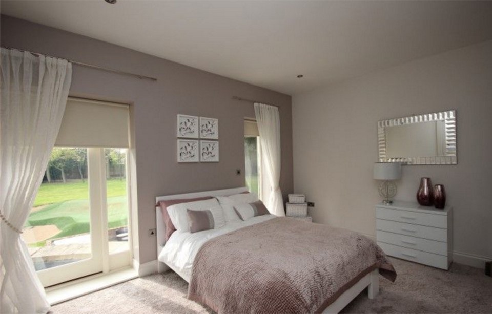  One of the smaller guest bedrooms overlooking the large garden are