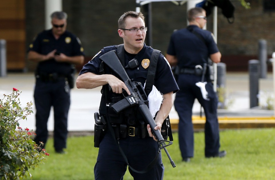 Police guard the emergency room entrance of Our Lady Of The Lake Medical Center, where wounded officers were brought, in Baton Rouge