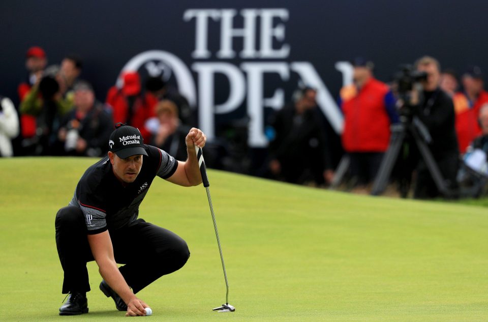  Stenson lines up a putt on the 18th hole as he nears victory in the Open at Troon