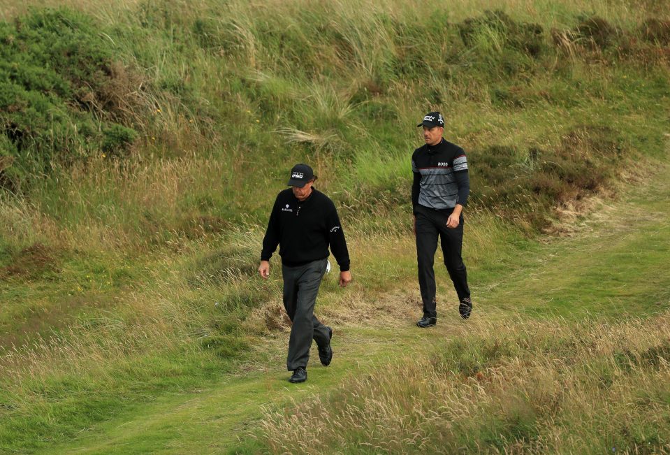  Phil Mickelson and Henrik Stenson walk between holes in their classic battle