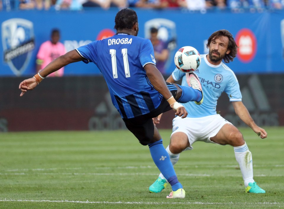 Didier Drogba tries to take on Andrea Pirlo