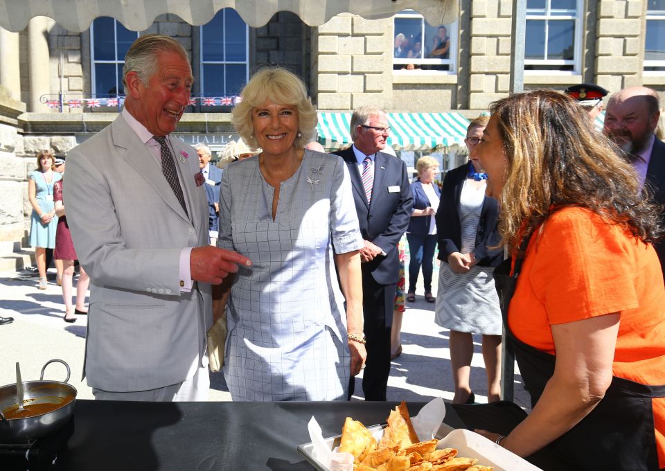  Making a joke Camilla even caught Charles out by pretending he had curry on his shirt - making him look