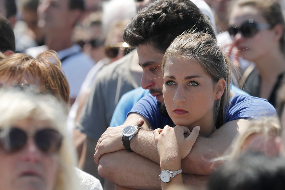  Shock... people observe a minute's silence on the famed Promenade des Anglais in Nice