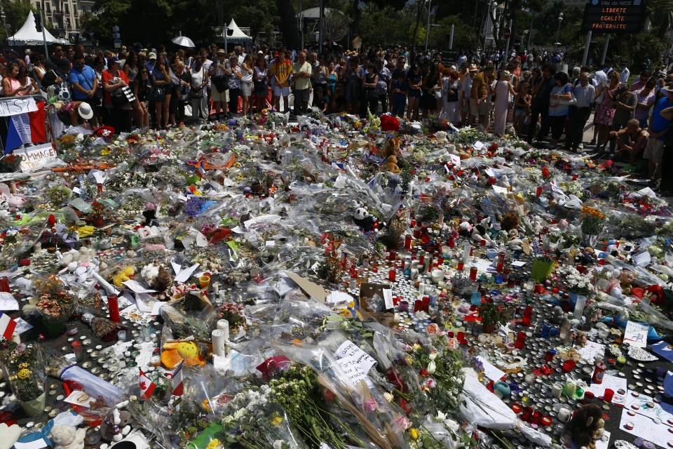  Flowers are laid at the makeshift memorial along the Promenade des Anglais in Nice to honour victims of the attack