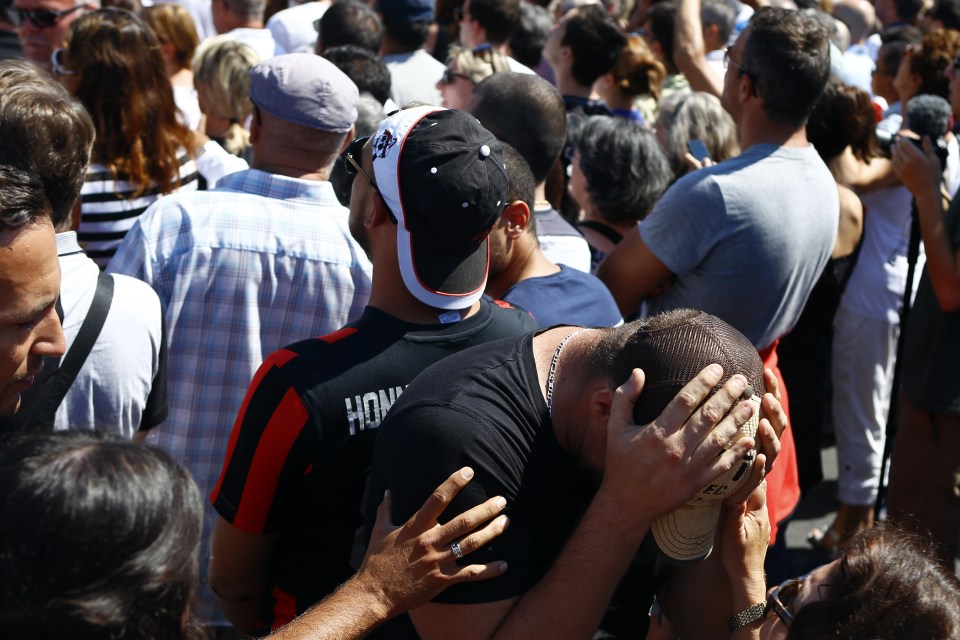  Agony... people react after a minute's silence to honour victims of an ISIS truck attack that killed 84 people in Nice