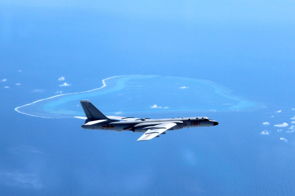  A Chinese H-6K nuclear bomber patrols over the South China Sea as it ramps up tensions with the US over the firecely contested islands