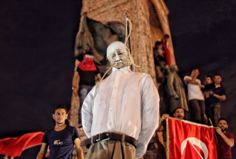  Erdogan supporters hang the effigy in Taksim square in Istanbul