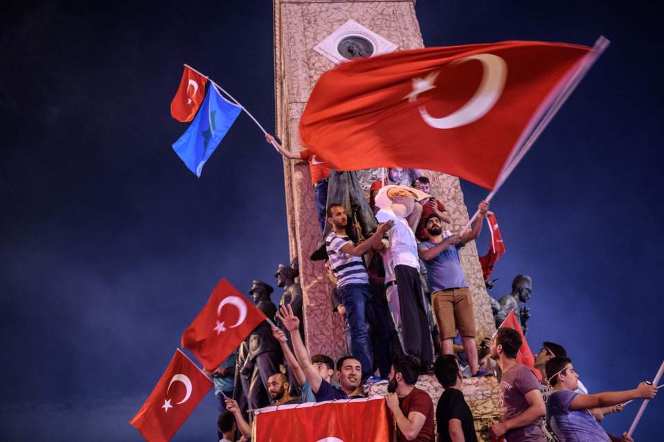  Pro-Erdogan supporters hold an an effigy of US-based preacher Fethullah Gulen during a rally at Taksim square in Istanbul