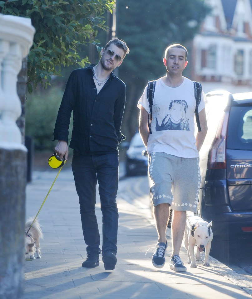 EXCLUISVE PICTURES 300 ONLINE Nick Grimshaws new flame.... Nick posts a sizzling SnapChat of a mystery man at the park then they are then pictured walking back to Nicks new East London pad with dogs in tow. BYLINE MUST READ: KP PICTURES