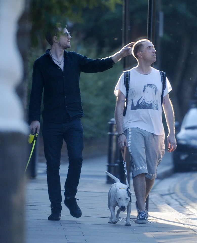 EXCLUISVE PICTURES 300 ONLINE Nick Grimshaws new flame.... Nick posts a sizzling SnapChat of a mystery man at the park then they are then pictured walking back to Nicks new East London pad with dogs in tow. BYLINE MUST READ: KP PICTURES