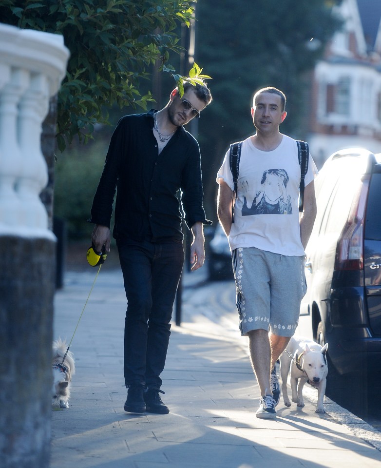 EXCLUISVE PICTURES 300 ONLINE Nick Grimshaws new flame.... Nick posts a sizzling SnapChat of a mystery man at the park then they are then pictured walking back to Nicks new East London pad with dogs in tow. BYLINE MUST READ: KP PICTURES