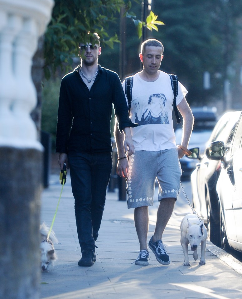 EXCLUISVE PICTURES 300 ONLINE Nick Grimshaws new flame.... Nick posts a sizzling SnapChat of a mystery man at the park then they are then pictured walking back to Nicks new East London pad with dogs in tow. BYLINE MUST READ: KP PICTURES