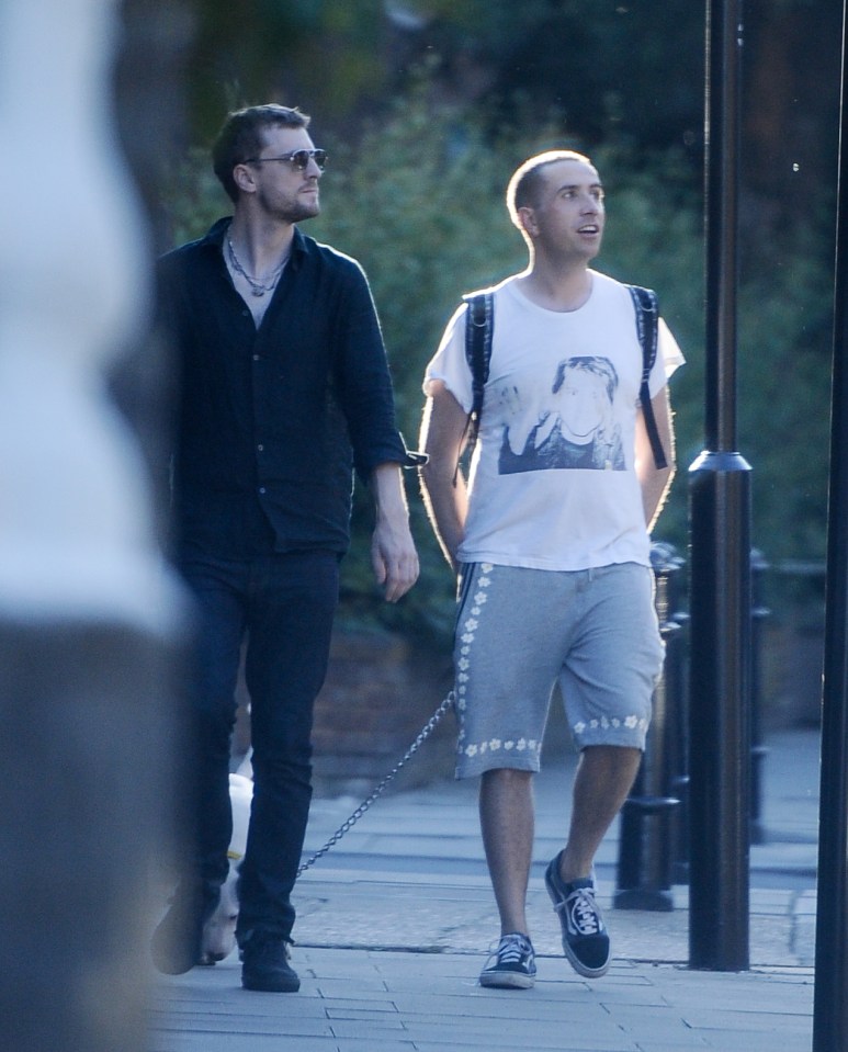 EXCLUISVE PICTURES 300 ONLINE Nick Grimshaws new flame.... Nick posts a sizzling SnapChat of a mystery man at the park then they are then pictured walking back to Nicks new East London pad with dogs in tow. BYLINE MUST READ: KP PICTURES