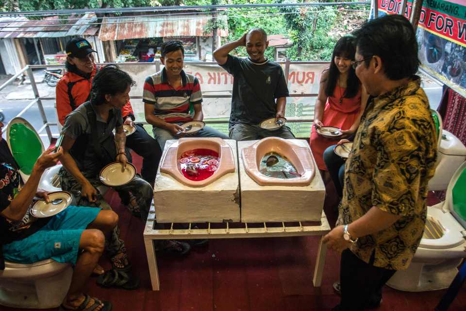  Diners must sit on upright toilets and are then served their food from squat loos