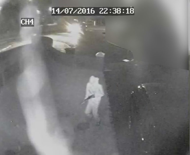 CCTV captures the moment the mystery gunmen arrives at the house