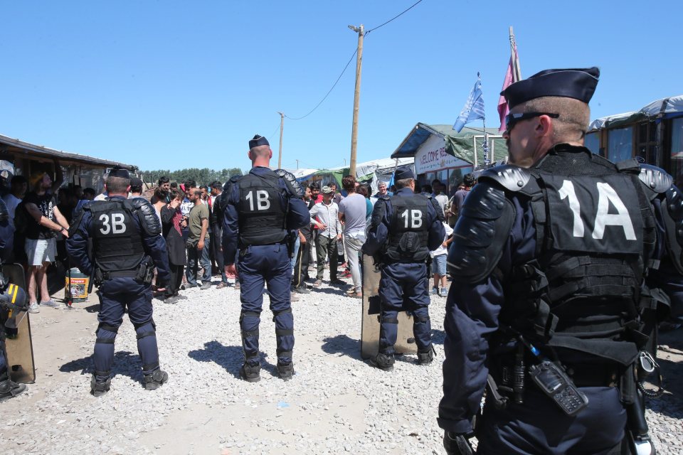  Ringfencing . . .armoured French cops at The Jungle migrant camp in Calais