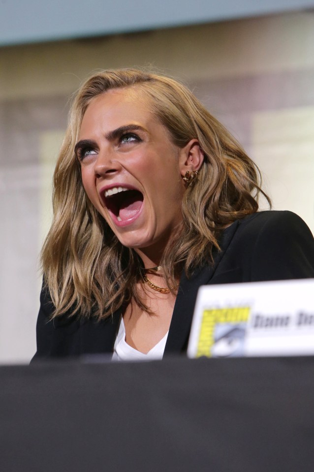  Cara looked thrilled with her new hairstyle as she took part in the press conference