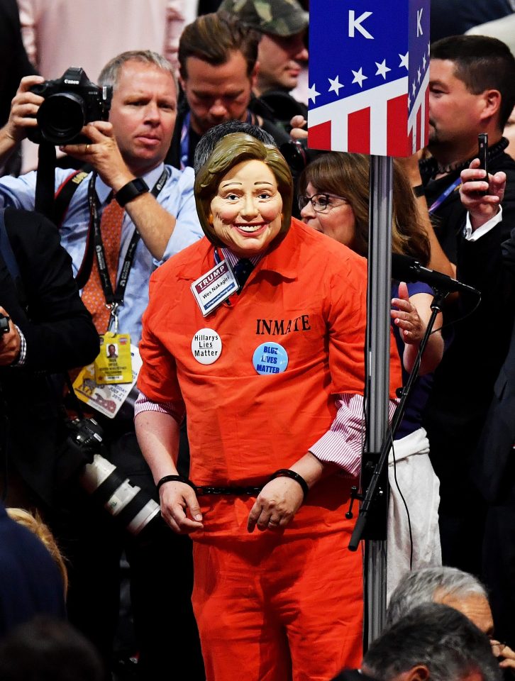  The crowd mocked Hillary Clinton chanting 'lock her up' and one fan dressed in orange prison style jumpsuit and Hillary mask