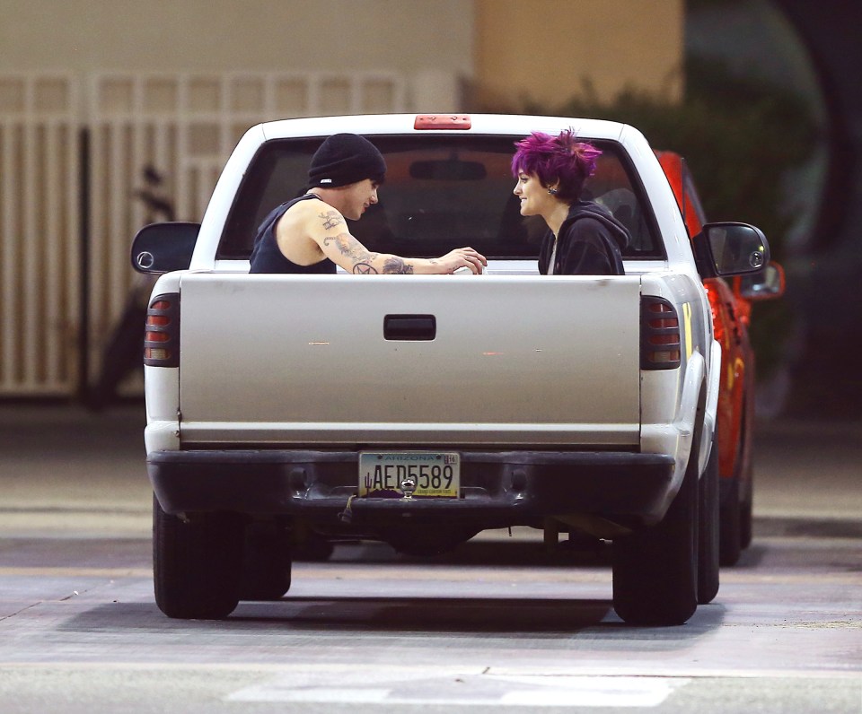  The cool couple were seen riding in the back of a friend's truck