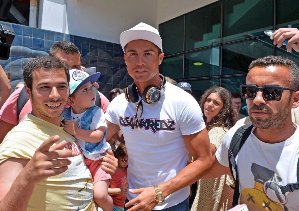  Cristiano Ronaldo is mobbed by fans after flying back into Santa Catarina Airport which will now be renamed after him