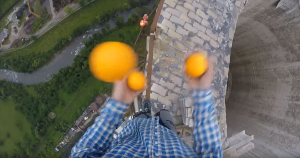  The free-funner even finds time to juggle at the top of the giant stack