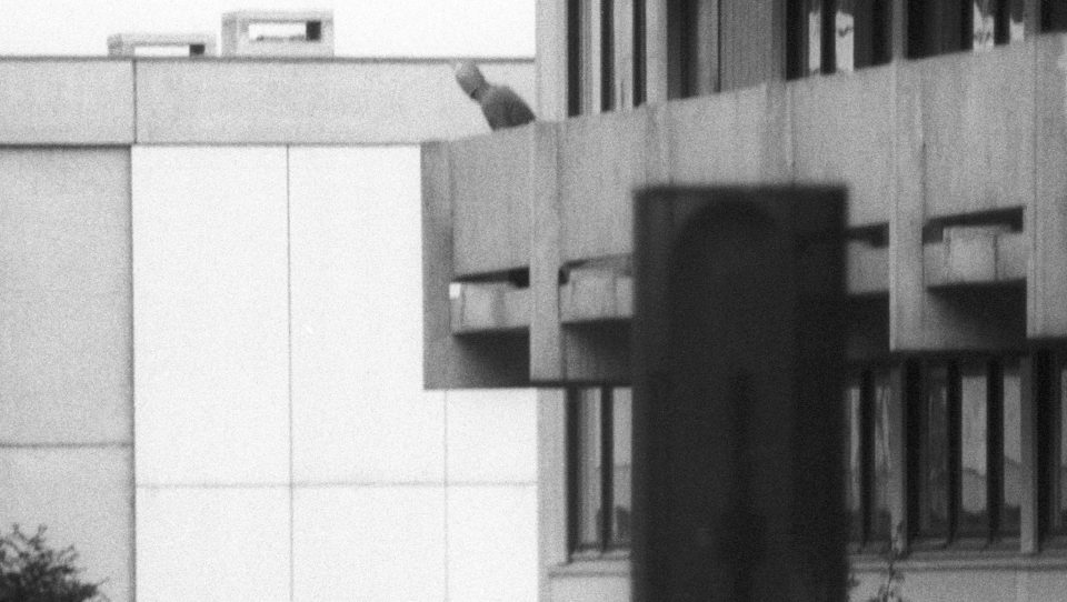  Hostage-taker ... Black September member stands on the balcony of the Israeli Olympic team quarters in September 1972, streets away from where Friday's atrocity took place