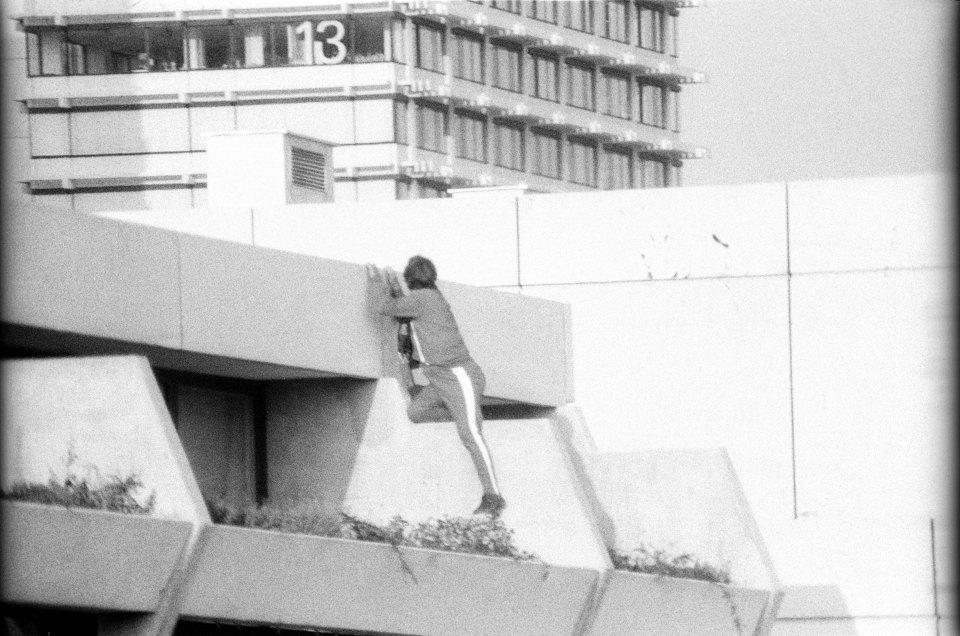  Standoff ... West German security official keeps an eye on the quarters of the Israili Olympic team