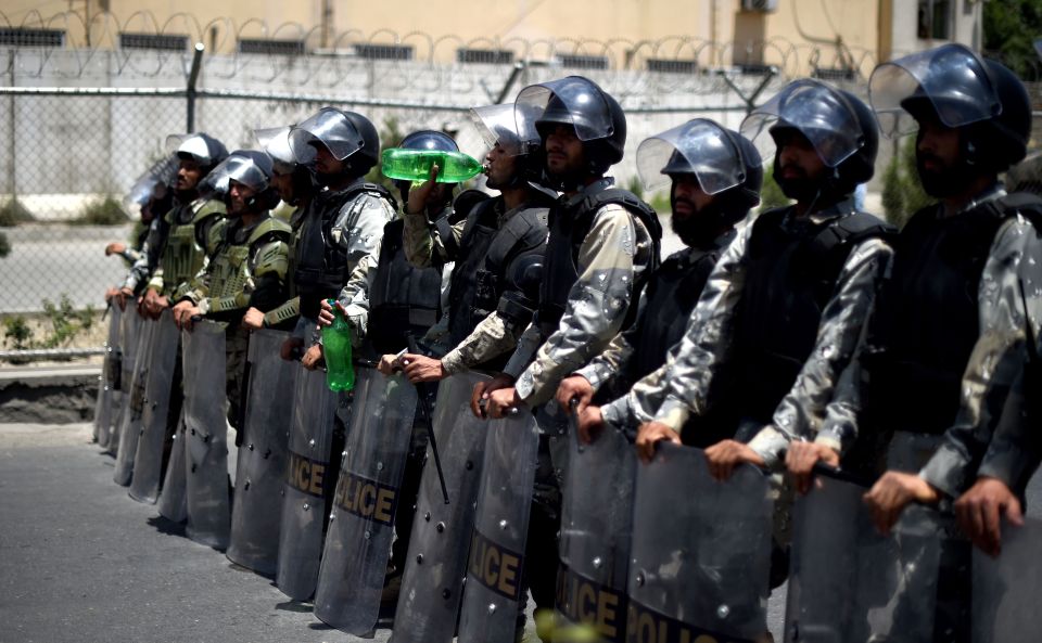  Afghan riot police standing guard before the suicide blasts