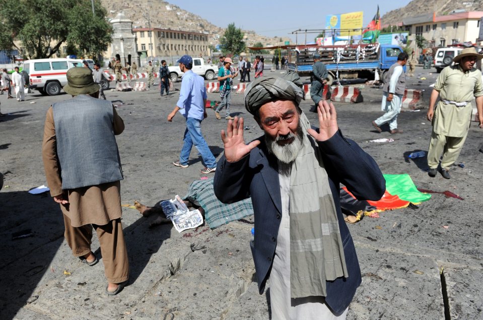  A man from Hazara minority reacts after a suicide bomb attack in Kabul