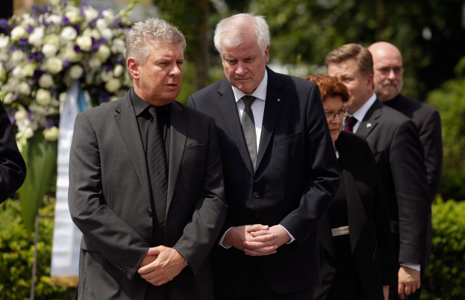  Munich mayor Dieter Reiter, left, and state governor Horst Seehofer attend a wreath-laying ceremony in memory of those who died