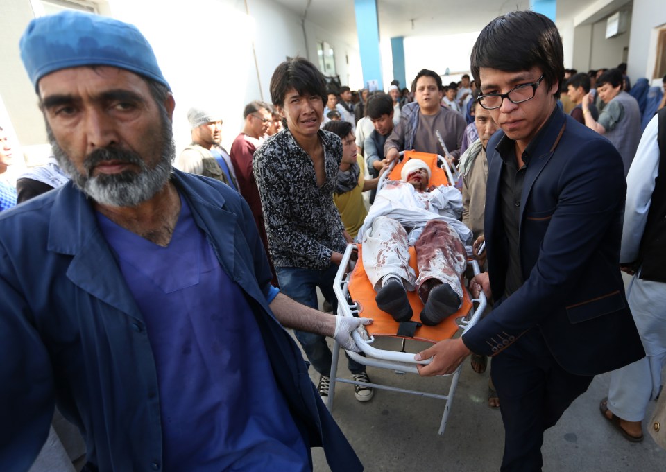  An injured man is rushed to hospital for treatment after the attack in Kabul