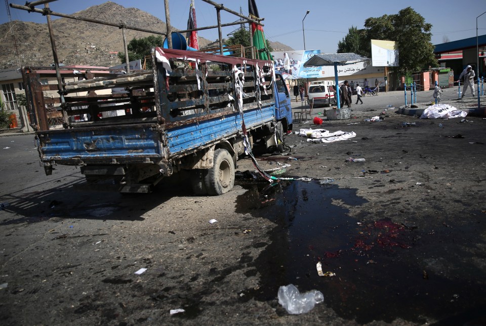  A truck, used by some leaders of a protest march, is damaged after a deadly explosion