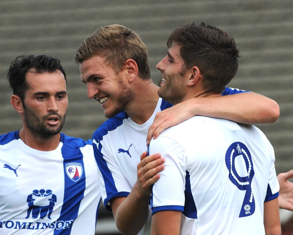 The Welshman celebrates with his new team-mates after finding the back of the net