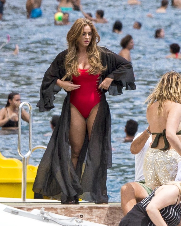  The former Geordie Shore star showed off her curves in a classic red swimsuit which featured on trend cut outs along the sides