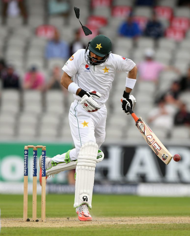 Pakistan captain Misbah-ul-Haq is clattered by a bouncer from Chris Woakes