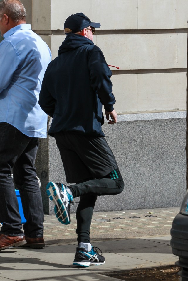 Ex- Top Gear Chris Evans makes a run for it as he leaves BBC Radio Two studios to avoid the press after the Wee gate pictures - London