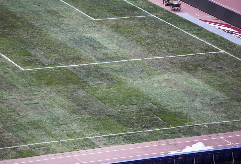  The relaid pitch in Beijing is a sorry patchwork of turf squares