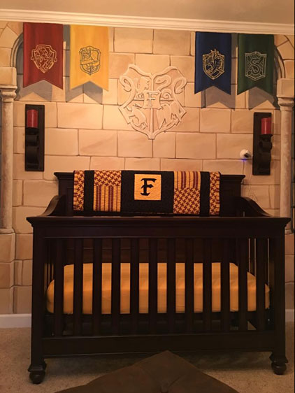  The banners of Hogwarts houses hang above the cot